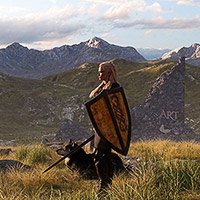a Viking warrior with her wolf