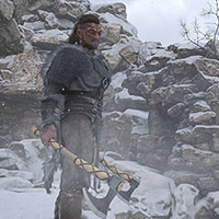 a battle-hardened Viking stands atop a snow-covered peak...
